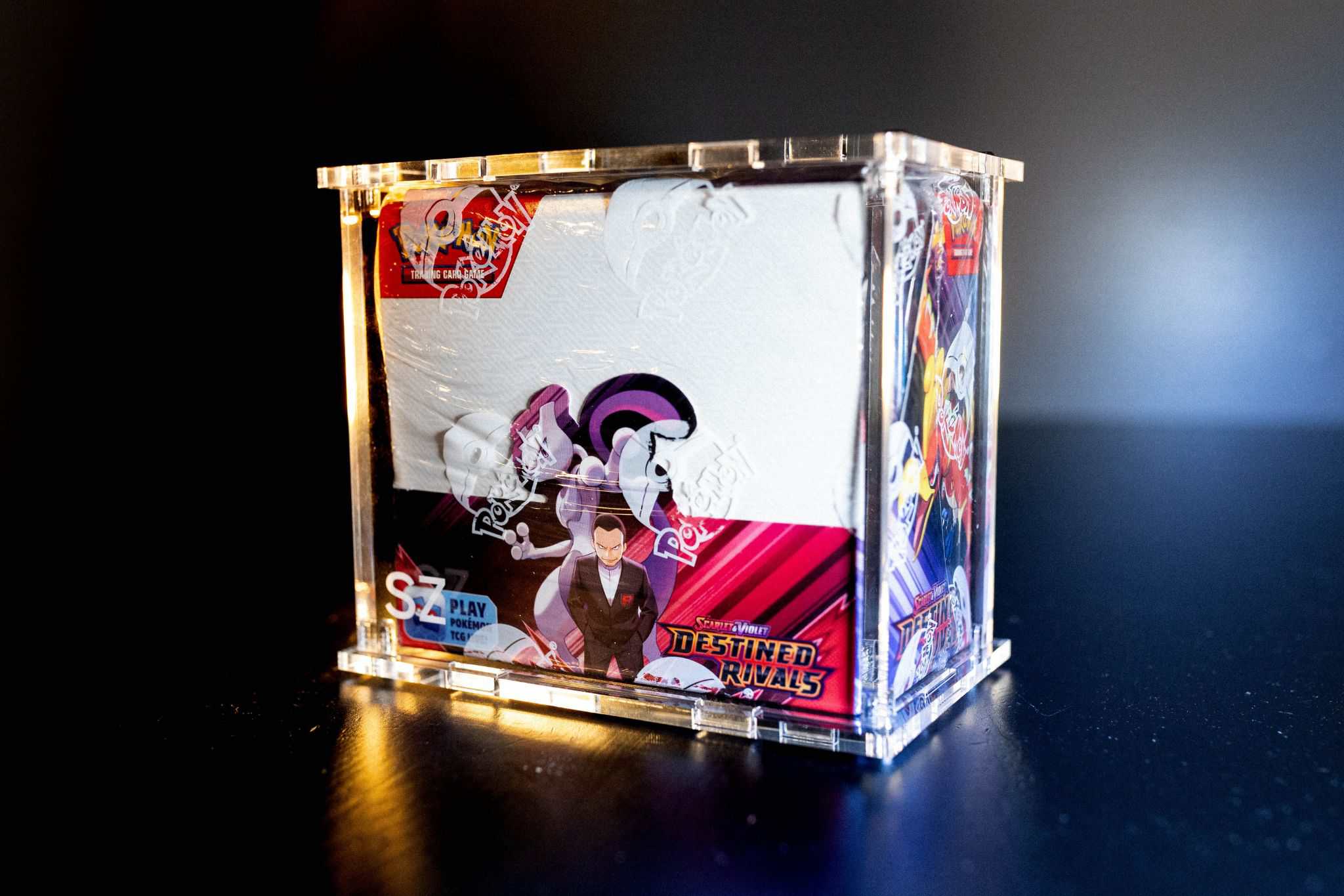 Booster box inside an SZ Cases acrylic protector